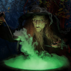 Illustration of witch peering over bubbling cauldron of brew